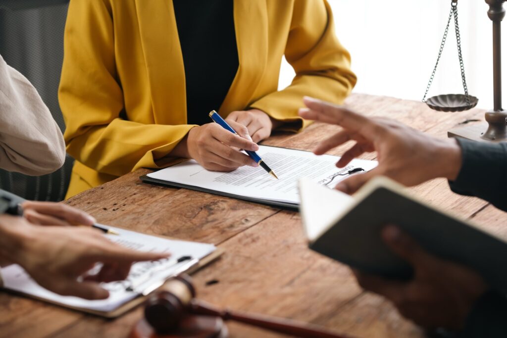 Lawyer going over paperwork with clients