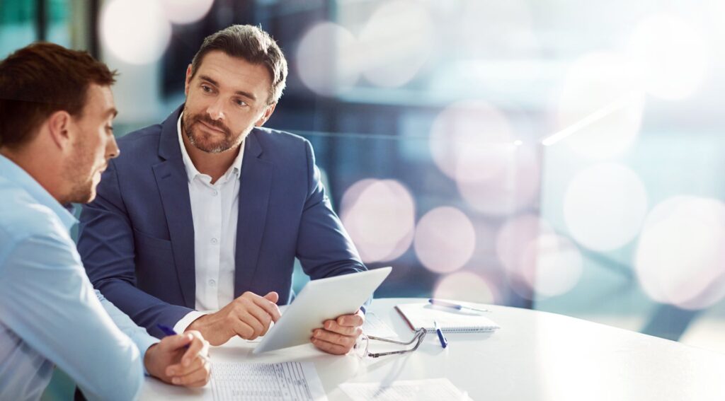 two met at a table going over paperwork