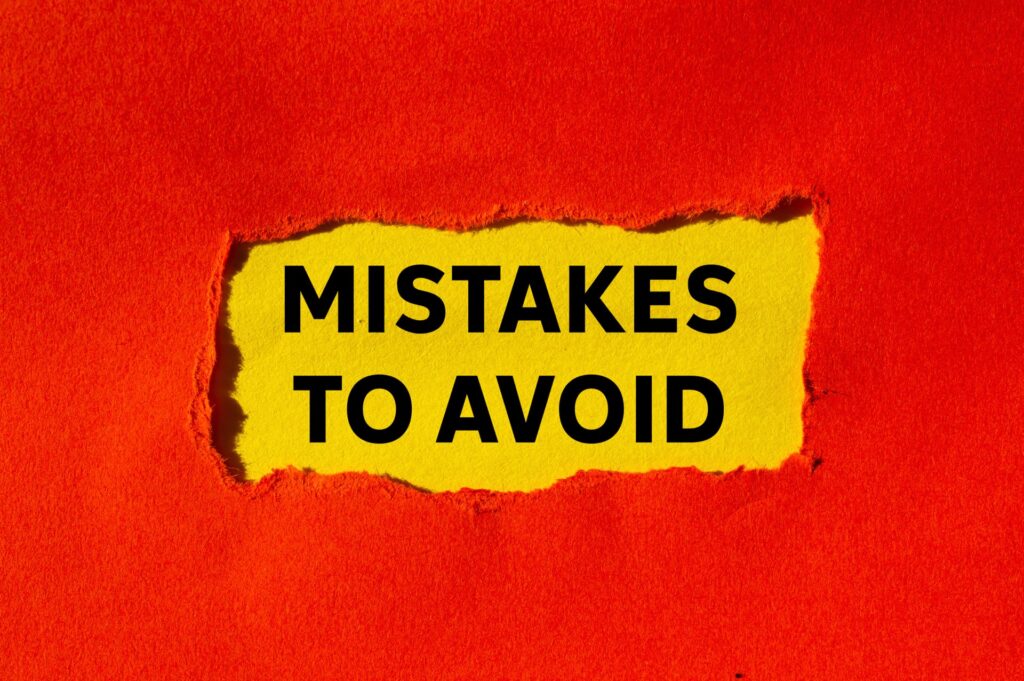 MIstakes to avoid written on ripped torn red paper