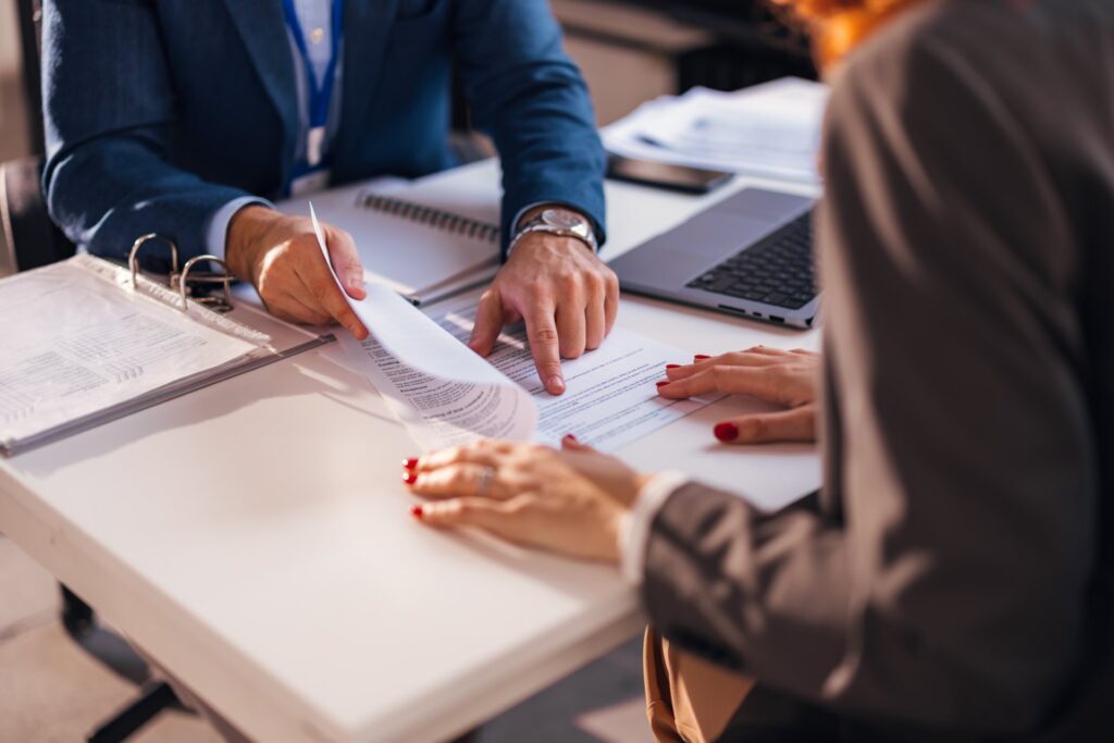 Two people going over a contract